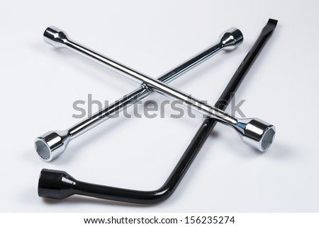 stock-photo-lug-wrench-and-tire-iron-isolated-on-white-somewhat-shallow-depth-of-field-room-for-copy-space-156235274.jpg