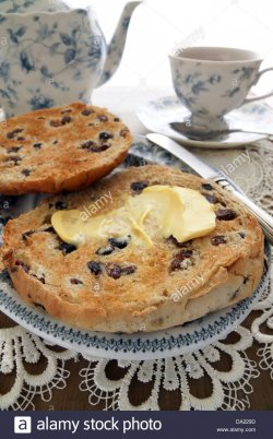 toasted-teacakes-a-traditional-british-cake-of-raisin-sultanas-and-DA229D.jpg
