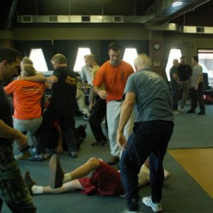 Doing some work. Eric and friend showing some love to a floored training partner  2006