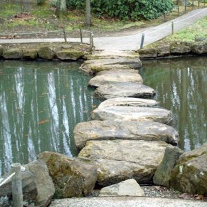 Stones bridging a narrow section of the pond