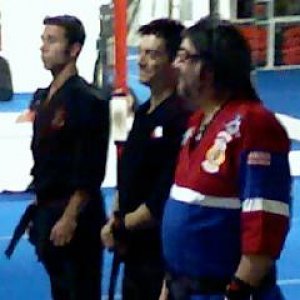 Shihan-Sensei Louis D. Casamassa is wearing the red, white, and blue gi, next to him are his sons Shihan Chris and Sensei Scott.