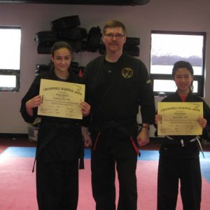 Sophia and Ashley being promoted to Black belt and JR black belt! May 2014