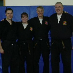 The four 2004 black belts from our school - CB, myself, MC and NCG.