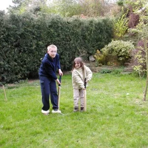 Adrian as a young child learning cricket