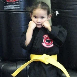 My youngest right after earning her pee wee yellow belt!