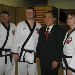 My parents, Kwan Jang Sok Ho Kang, and myself after my 5th dan test.