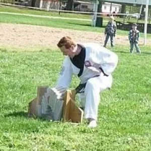 Me, 7 concrete cap blocks with a knife hand