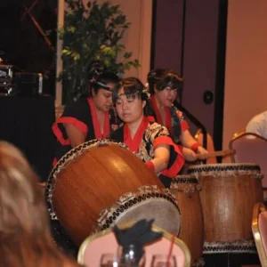 Banquet entertainment of an all-female group on drums.