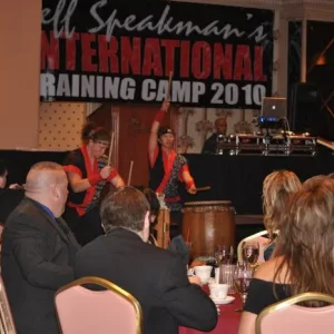 Banquet entertainment of an all-female group on drums.