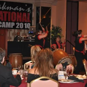Banquet entertainment of an all-female group on drums.