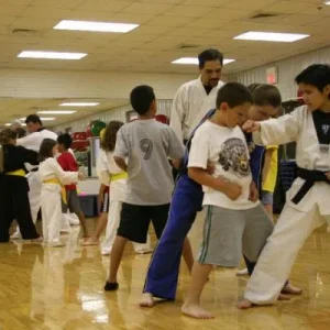 Lynn (foreground) and Angie (in blue) working with a new student on one steps.