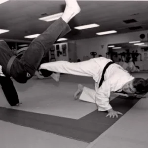 Low spinning sweep against a high spinning kick. Photo was taken by Tom Pennington, UTA Shorthorn photographer, in 1995 for a story.