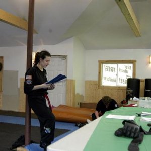 Just finished testing for my first black belt here, reading my essay about what becoming a black belt means to me. (December 2004)
