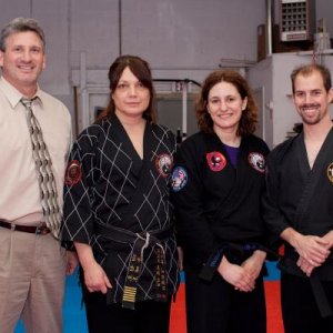 Posing with some my instructor and other blackbelts after my Tae Kwon Do black belt test, May 2009