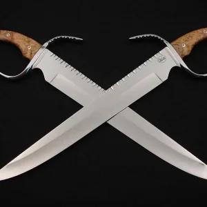 Modern tactical swords made by U.S. custom knife maker Mark Waite; he does a lot of work for me.  My design, his photo.