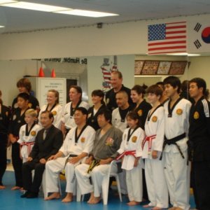 Post Black Belt test group photo. R's in the center, right
 behind the seated masters.