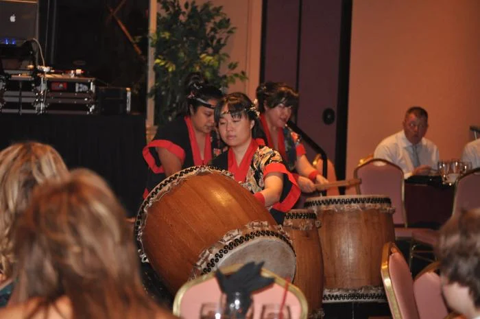 Banquet entertainment of an all-female group on drums.