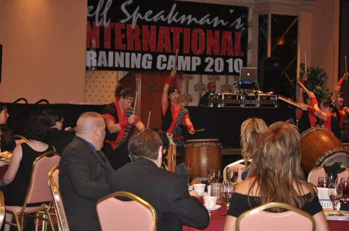 Banquet entertainment of an all-female group on drums.