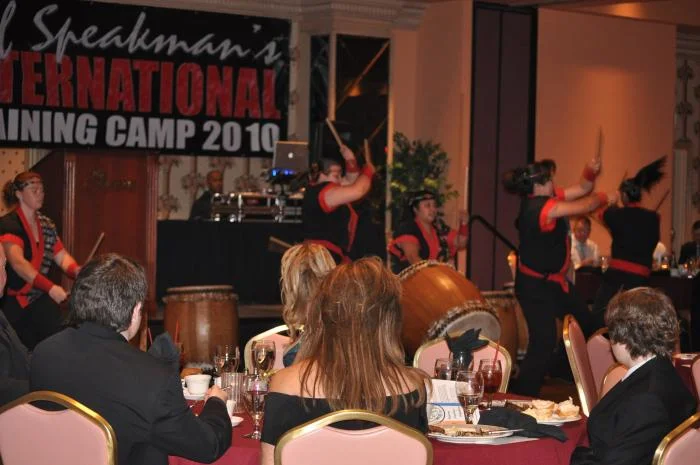 Banquet entertainment of an all-female group on drums.