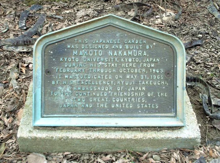 Bronze plaque at the entry of the garden