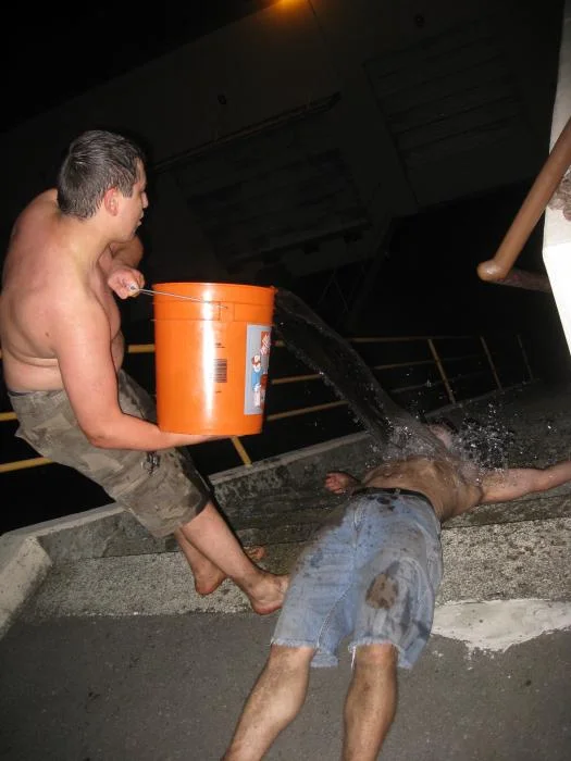 Couple of students combining clean-up with water boarding…this was before it was declared torture LOL and was still considered fun and interesting.