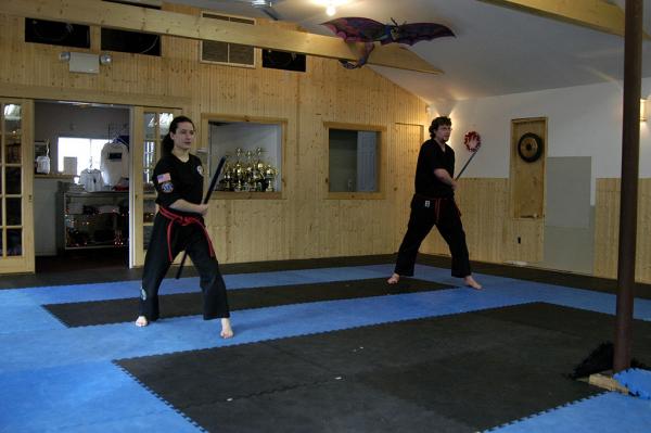 Doing my bo staff form as part of my black belt test, December 2004