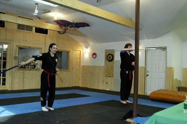 Doing my bo staff form as part of my black belt test, December 2004