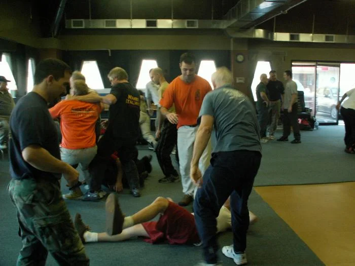 Doing some work. Eric and friend showing some love to a floored training partner  2006