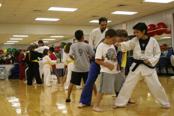 Lynn (foreground) and Angie (in blue) working with a new student on one steps.