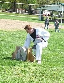 Me, 7 concrete cap blocks with a knife hand