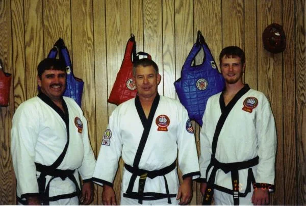 Me after my 4th dan test with my father (left) and my Sah Bum Nim (center)