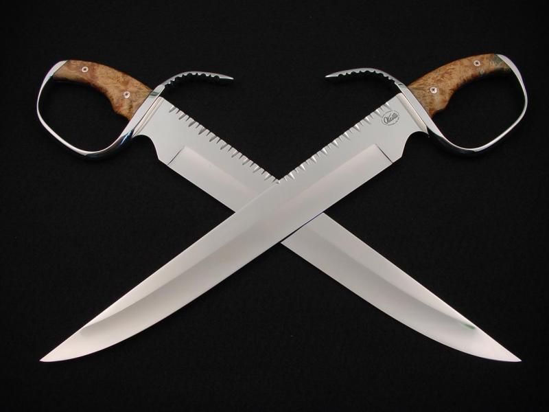 Modern tactical swords made by U.S. custom knife maker Mark Waite; he does a lot of work for me.  My design, his photo.