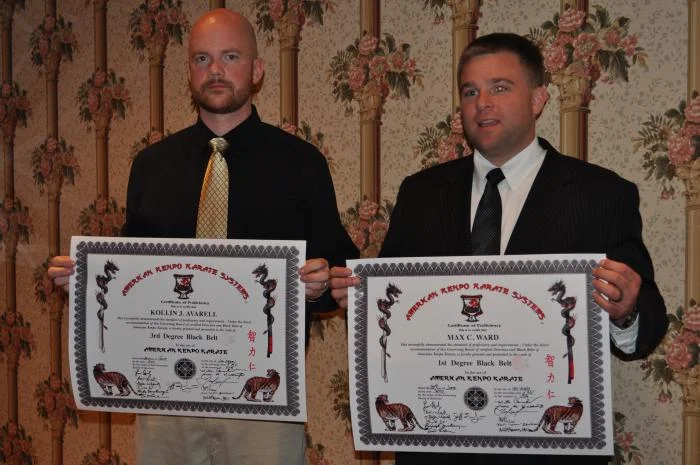 Mr Averall and Mr Ward's Black Belt Certificates