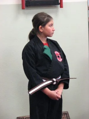 My oldest after her Jr. Brown Belt promotion