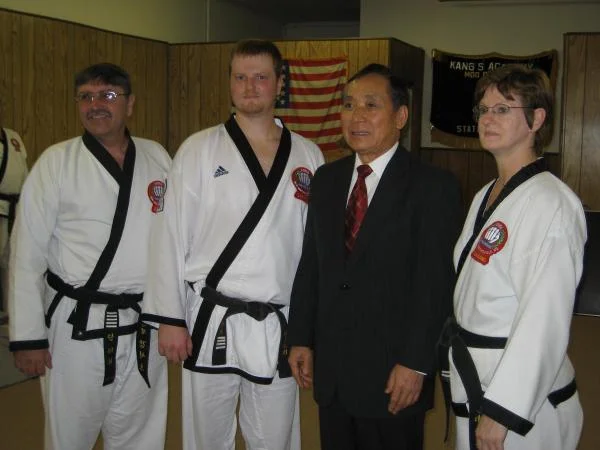 My parents, Kwan Jang Sok Ho Kang, and myself after my 5th dan test.