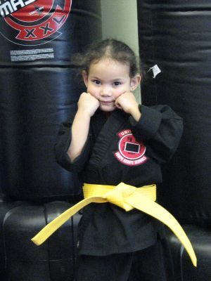 My youngest right after earning her pee wee yellow belt!