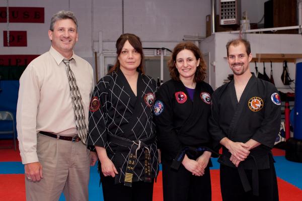 Posing with some my instructor and other blackbelts after my Tae Kwon Do black belt test, May 2009