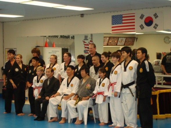 Post Black Belt test group photo. R's in the center, right
 behind the seated masters.