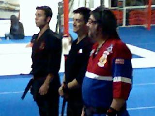 Shihan-Sensei Louis D. Casamassa is wearing the red, white, and blue gi, next to him are his sons Shihan Chris and Sensei Scott.