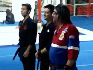 Shihan-Sensei Louis D. Casamassa is wearing the red, white, and blue gi, next to him are his sons Shihan Chris and Sensei Scott.