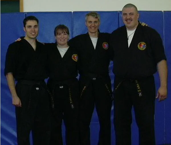 The four 2004 black belts from our school - CB, myself, MC and NCG.