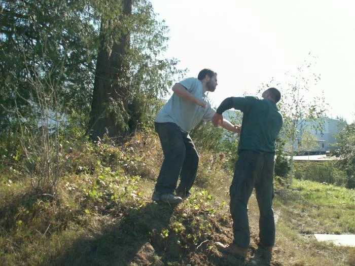 Training outdoors Sat 10 11 08 working on uneven rough ground covered with hidden obstacles and dangers and lessons. Here some students are working wh