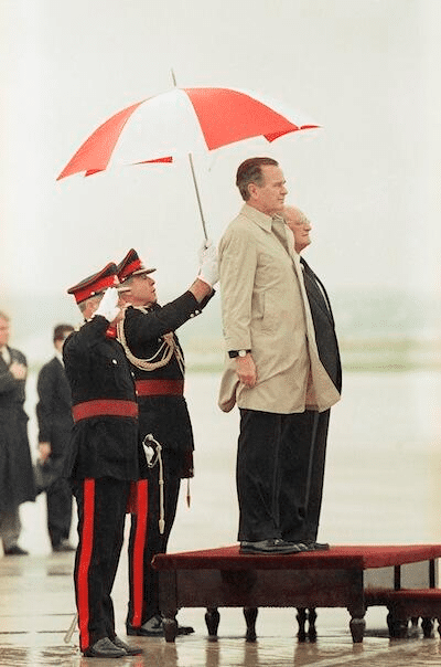 bush-with-marines-holding-umbrella.png