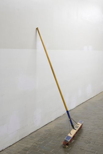 broom-against-a-white-wall-picture-id80470671